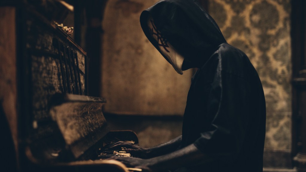 single sleep token - Vessel jouant du piano avec son masque intégral